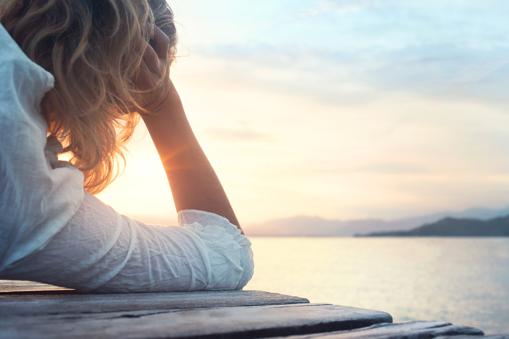 melancony woman observing the sunset