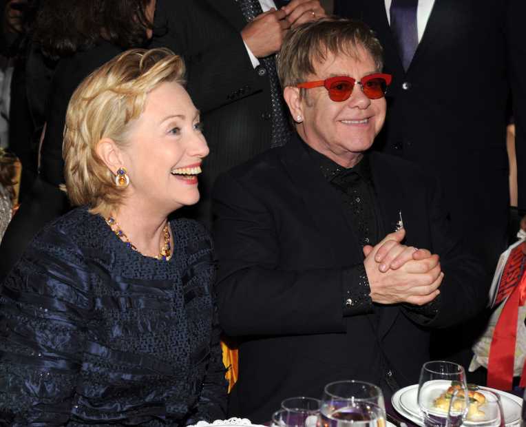 NEW YORK, NY - OCTOBER 15: Hillary Rodham Clinton and Elton John attend the Elton John AIDS Foundation's 12th Annual An Enduring Vision Benefit at Cipriani Wall Street on October 15, 2013 in New York City. (Photo by Kevin Mazur/WireImage)