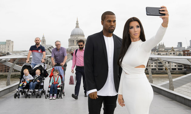 LONDON, UNITED KINGDOM - AUGUST 05: Kanye West and Kim Kardashian's 'selfie taking' wax figures seen at Millenium Bridge on August 05, 2015 in London, England. PHOTOGRAPH BY Jonathan Hordle / Barcroft Media (Photo credit should read Jonathan Hordle / Barcroft Media via Getty Images)