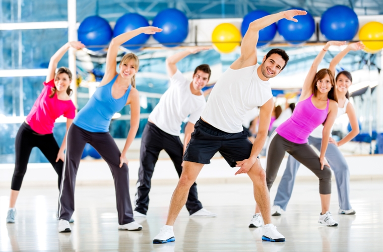 Group of people at the gym in an aerobics class