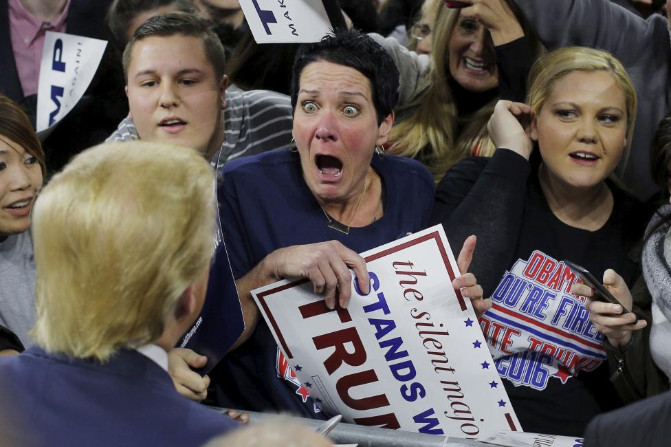 Audience member Robin Roy reacts as U.S. Republican presidential candidate Donald Trump greets her at a campaign rally in Lowell