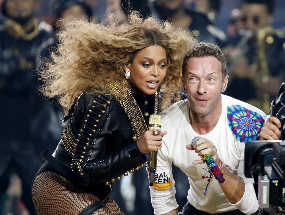 Beyonce and Chris Martin of Coldplay perform during the half-time show at the NFL's Super Bowl 50 between the Carolina Panthers and the Denver Broncos in Santa Clara