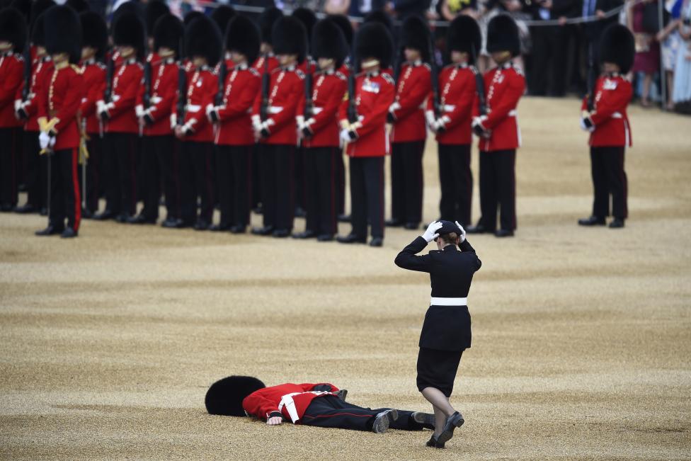 A Guardsman faints at Horseguards Parade for the annual Trooping the Colour ceremony in central London