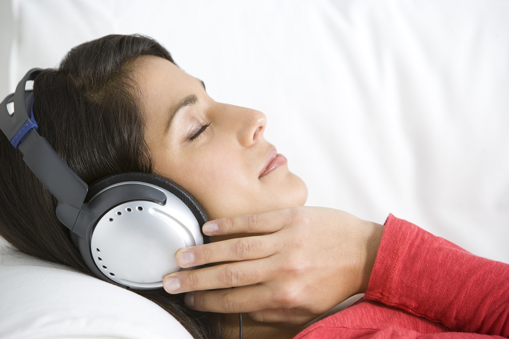 Woman Relaxing Listening To Music Wearing Headphones