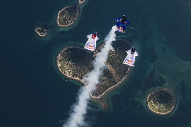 Marco Waltenspiel, Amy Chmelecki and Marco Fuerst fly their wingsuits over the heart island near Zadar, Croatia, November 30, 2016 // Wolfgang Lienbacher / Red Bull Content Pool // For more content, pictures and videos like this please go to www.redbullcontentpool.com