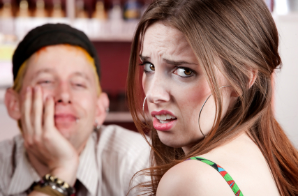 Young woman making an exasperated expression gesture on a bad date