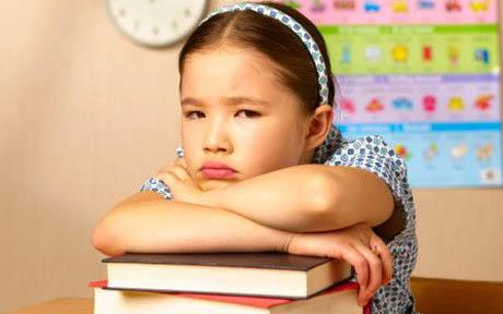 Mixed race school girl looking fed up