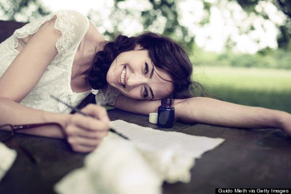 Woman writing love letter with ink