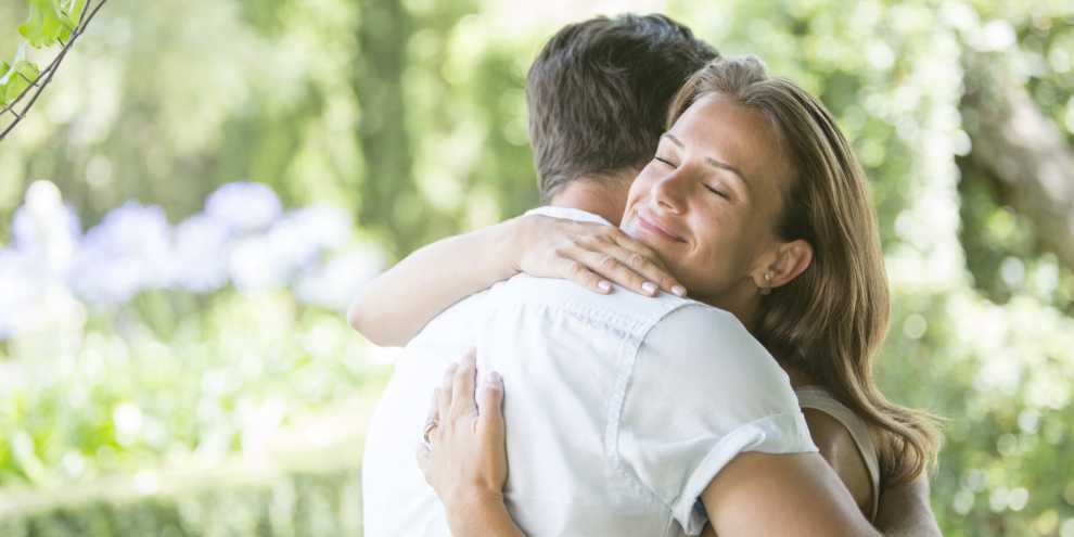 Couple hugging outdoors