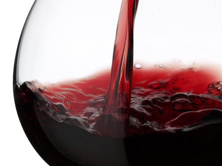 Red Wine Pouring into Glass