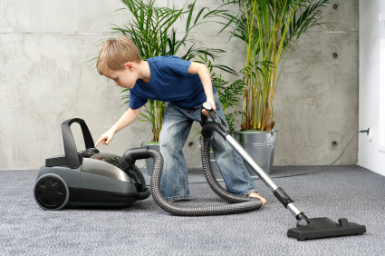 4-5 years old boy cleaning carper - housework