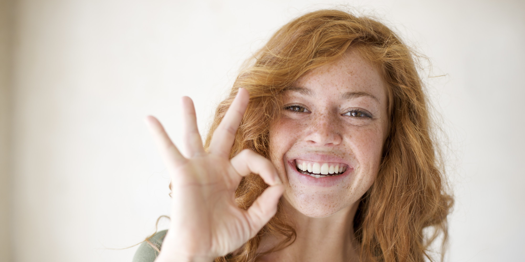 Optimistic Young Woman with Freckles