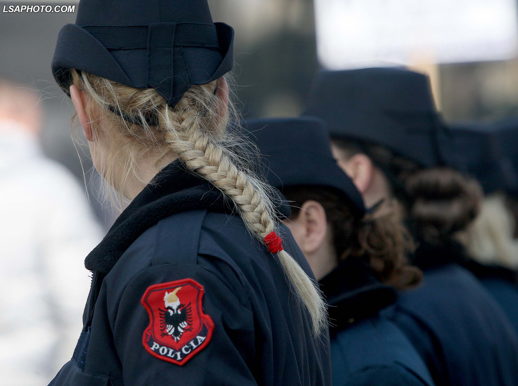 POLICIA MERR MASA PER PROTESTEN - Police femra, duke mbikqyrur protesten e organizuar nga opozita perpara godines se Kryeministrise, ku kane kerkuar doreheqjen e kryetarit te Kuvendit Ilir Meta, pas akuzave te deputetit Tom Doshi./r/n/r/nPOLICE TAKE MEASURES FOR PROTEST OF OPPOSITION - Policewomen stand in line during an opposition protest in front of the government building in Tirana on March 12, 2015, to demand the resignation of the Parliament speaker. The Albanian opposition requests the resignation of Parliament Speaker Ilir Meta, the junior ally in the government coalition and that of Socialist Prime Minister Edi Rama following accusations from former Socialist MP Tom Doshi, that Meta had commissioned his assassination. Meta maintains that the charges, which are being investigated by the Prosecution office, are fabricated.