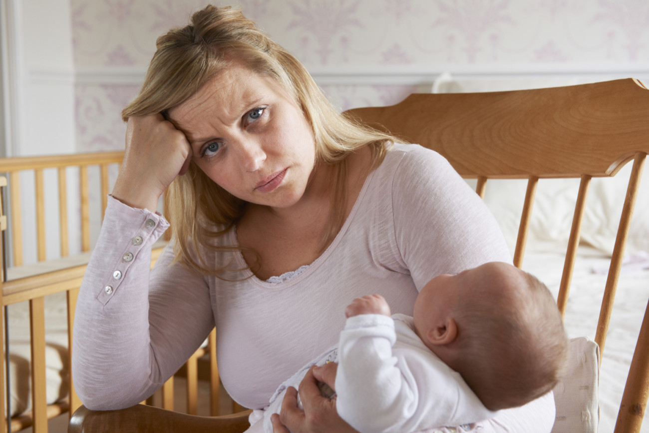 Tired Mother Suffering With Post Natal Depression