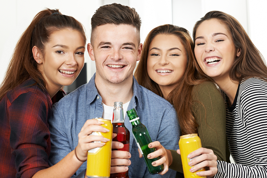 Group Of Teenagers Drinking Alcohol At Party