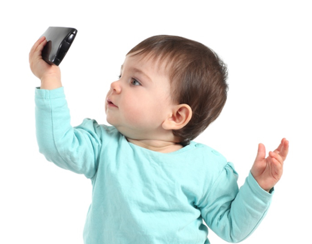 Baby watching a mobile phone