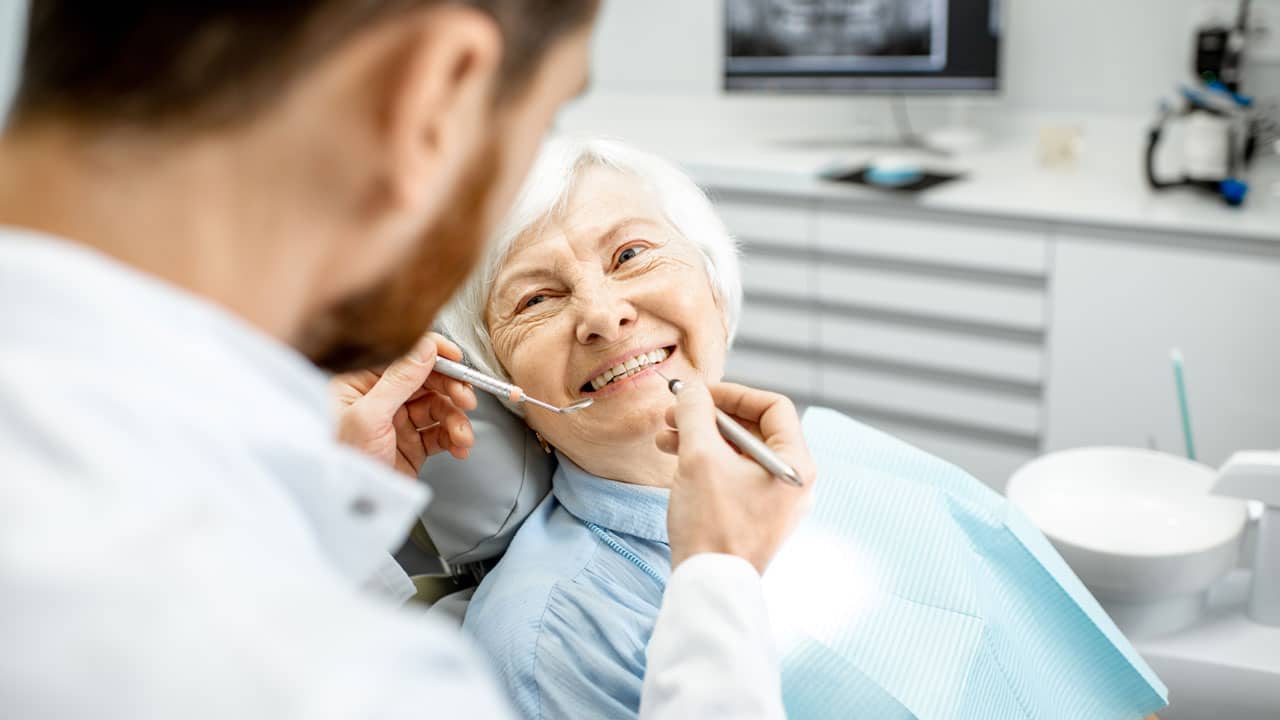 older-woman-at-dentist-min