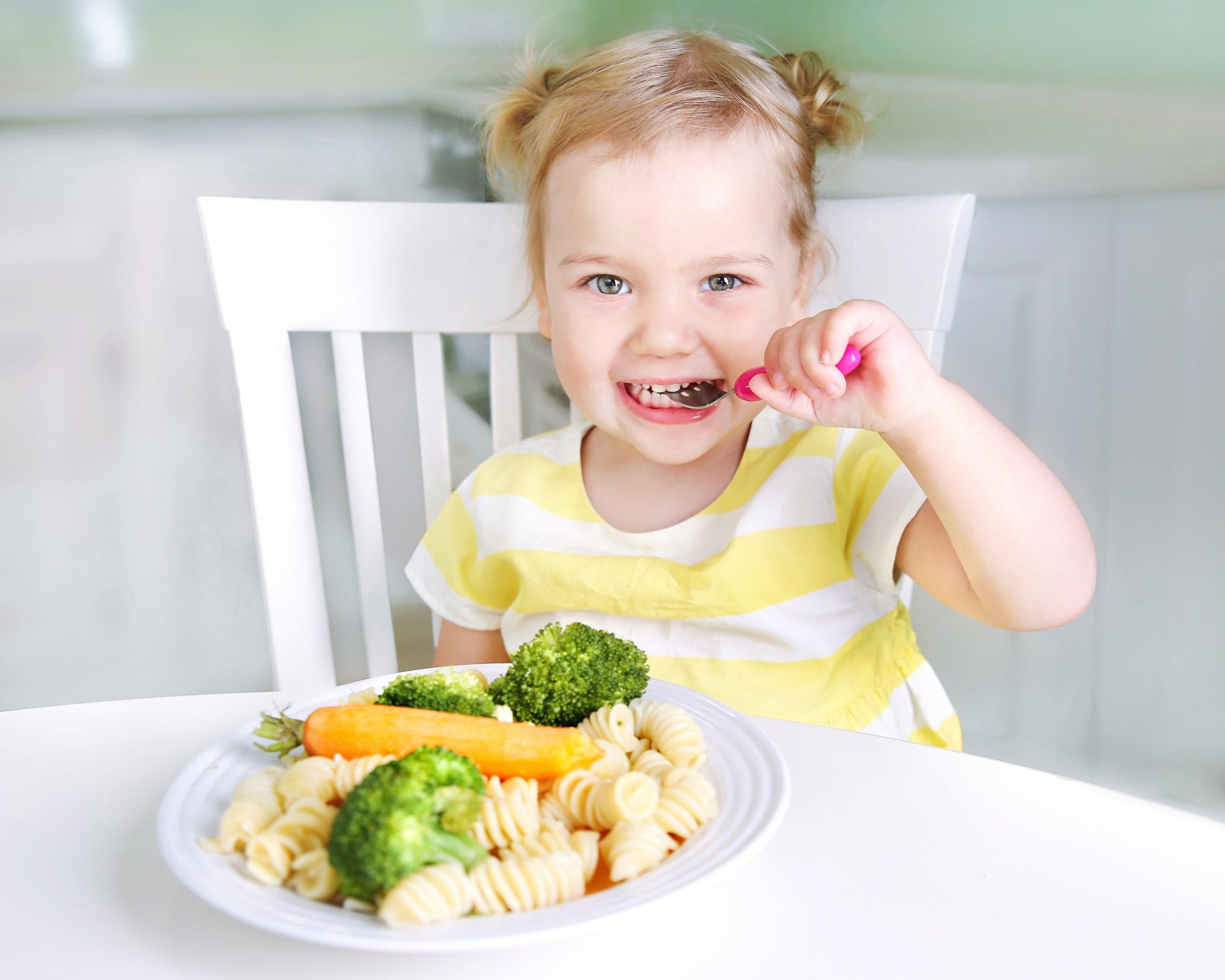 happy-girl-kid-eating-vegetables